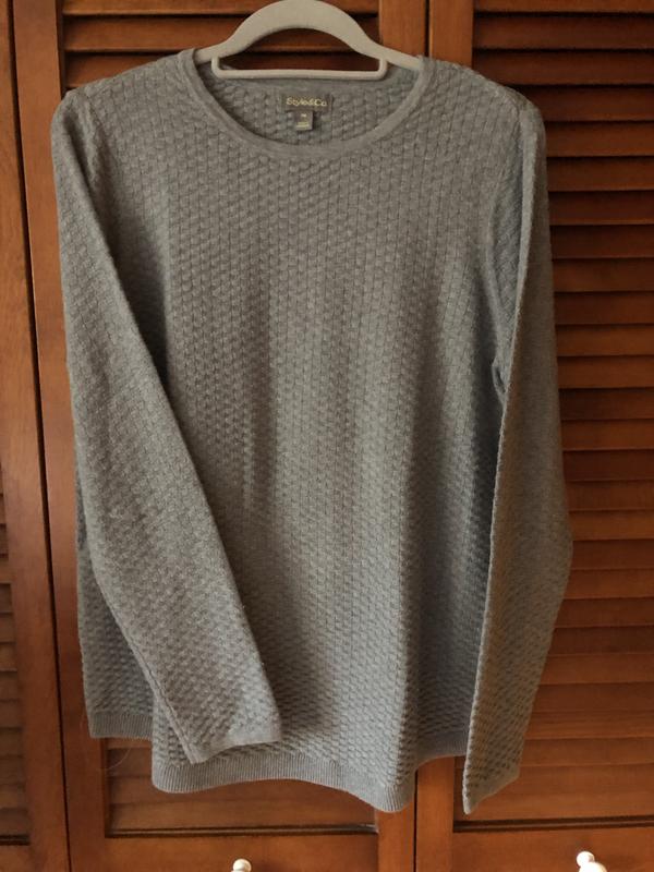 The top is shown alone and under a vest as a layering piece.