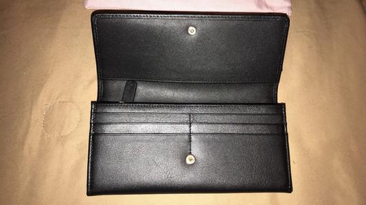 front of wallet when opened, card slots
