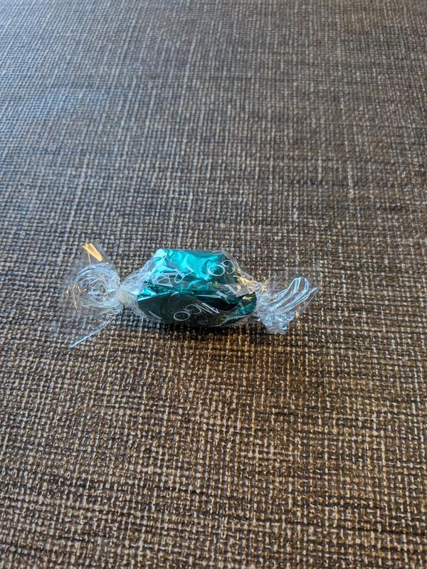 Chocolates are not completely wrapped in the green foil.