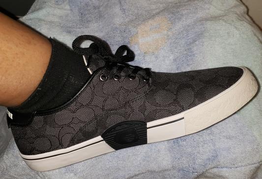 Instep of the shoe,has a line a the coach symbols in the middle