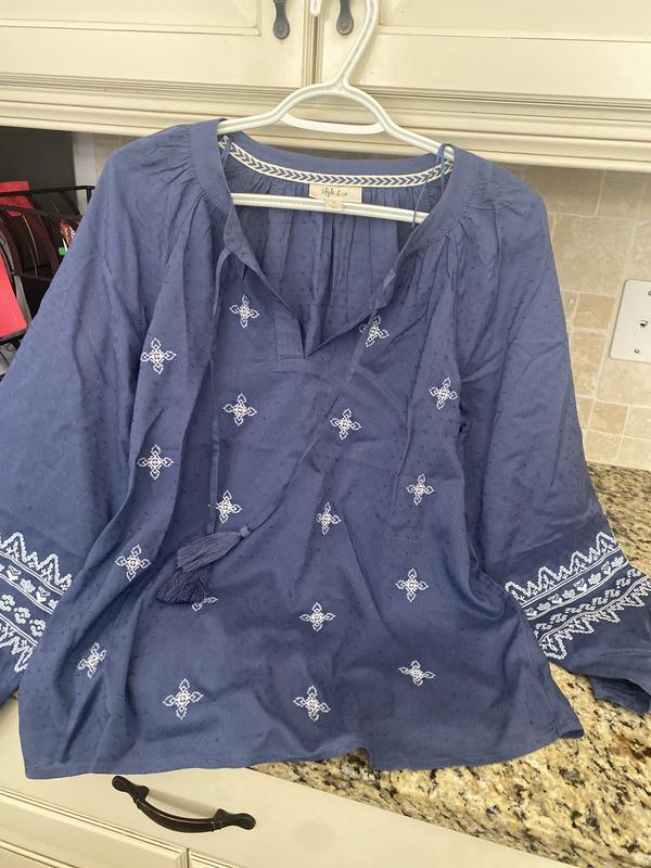 Notice the pretty embroidery