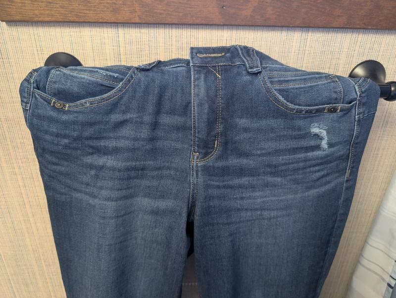 Distressing around pockets and front of pocket.