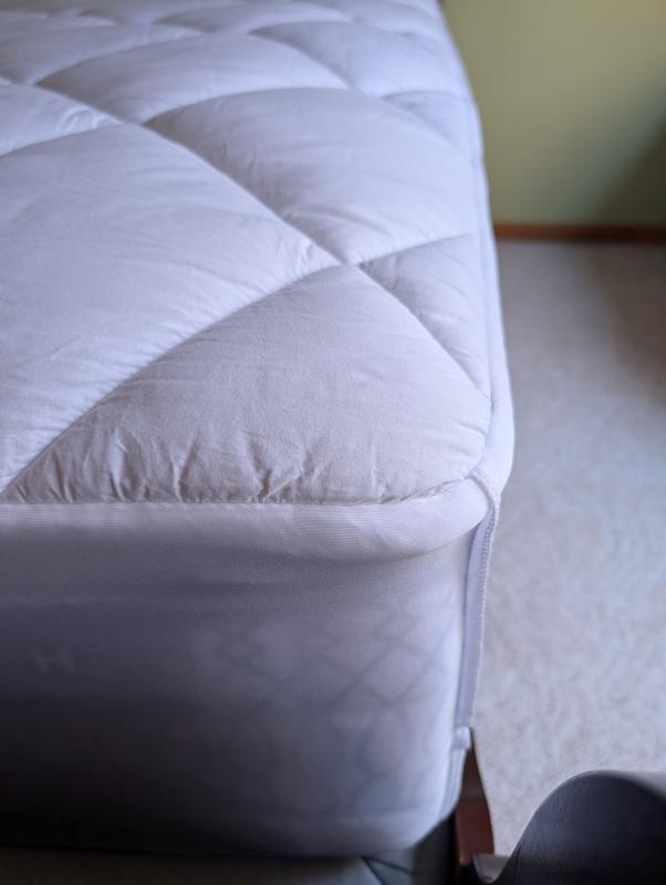 The mattress pad fits perfectly on the right side of the bed (near the foot of the bed).