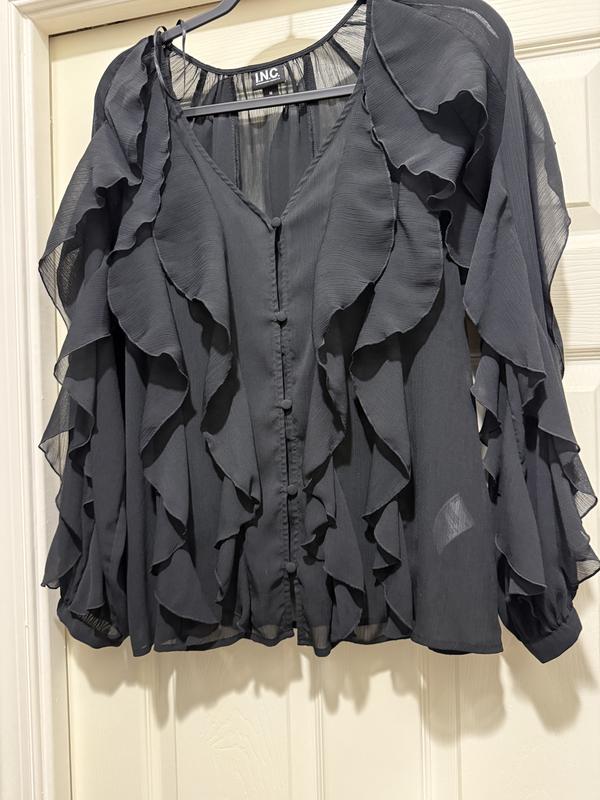 This photo shows the shirt against the door, as it doesn’t reflect how sheer the shirt really is.