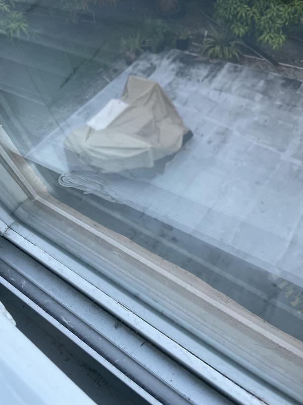 Covered table with chairs.