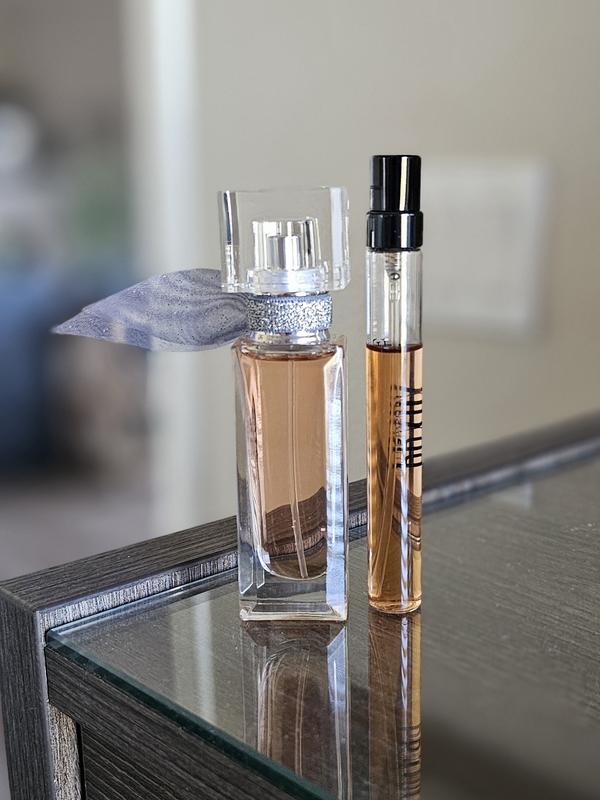 Placed next to a standard travel-size perfume for size reference