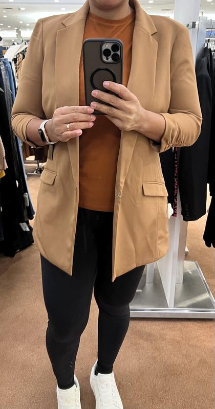 In the photo, the lighting made her look a little lighter than she really is.