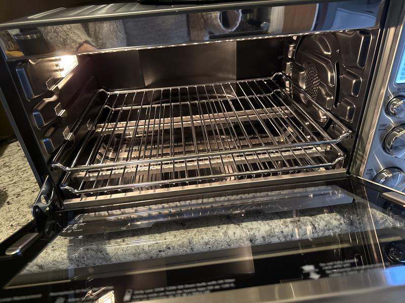 Macy’s slapped another label on box without removing the return label from previous customer who returned . Since they didn’t inspect contents I received damaged parts. Otherwise this oven is excellent