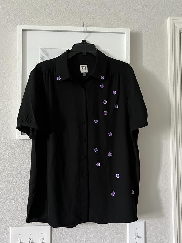 I needed black blouse to attend a funeral, the person who passed away loved color purple , guests were told to wear anything in purple , I bought this plane black blouse and I hand embroidered  purple lavenders on it .