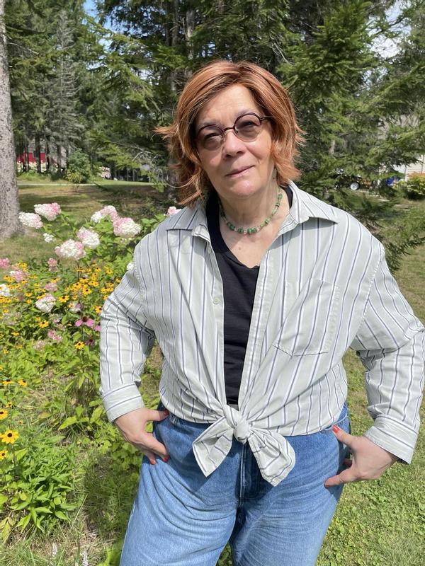 Gathered and tied up, enough to keep off the chill but still cool. Sleeves rolled.