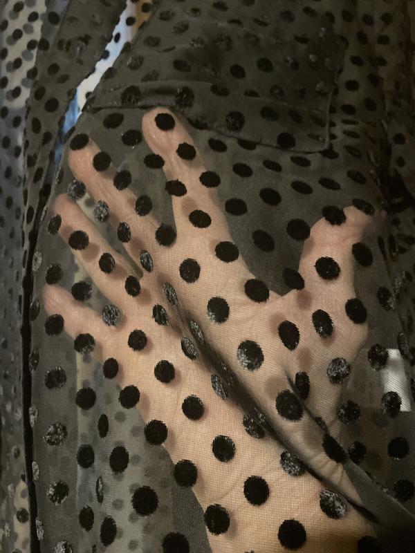 Showing you the sheerness of the shirt. You will need to wear something under it.