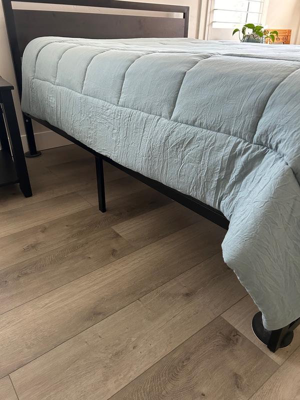 Comforter fits well on left side, coming down to beginning of bed rail right below mattress and very narrow box spring. Way too short, though, on right side.