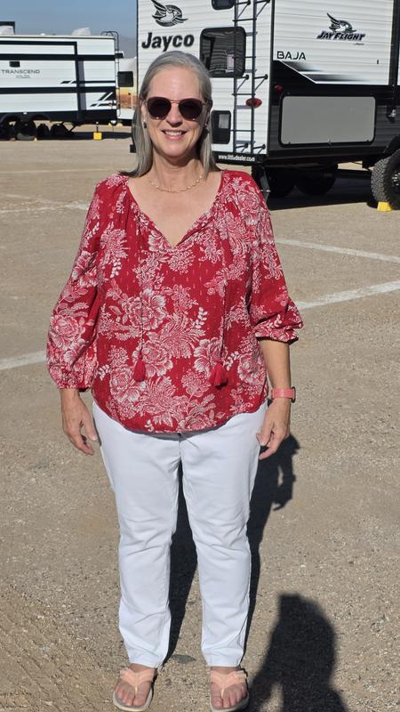 tassels untied, one sleeve up and one sleeve down