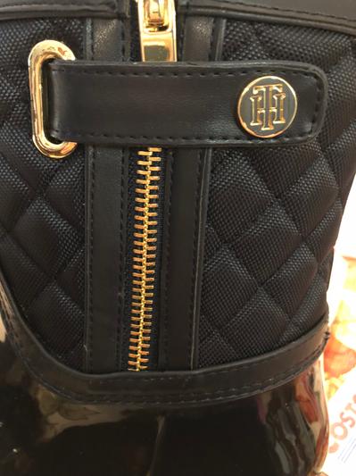 Side view of zipper and button