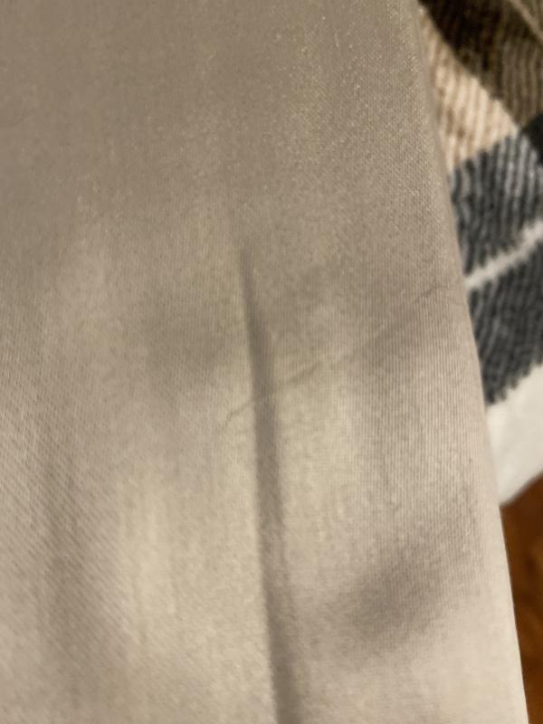 Looks like it already has a snag in it and a lot of loose thread