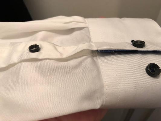 Cupped buttons on front and sleeves