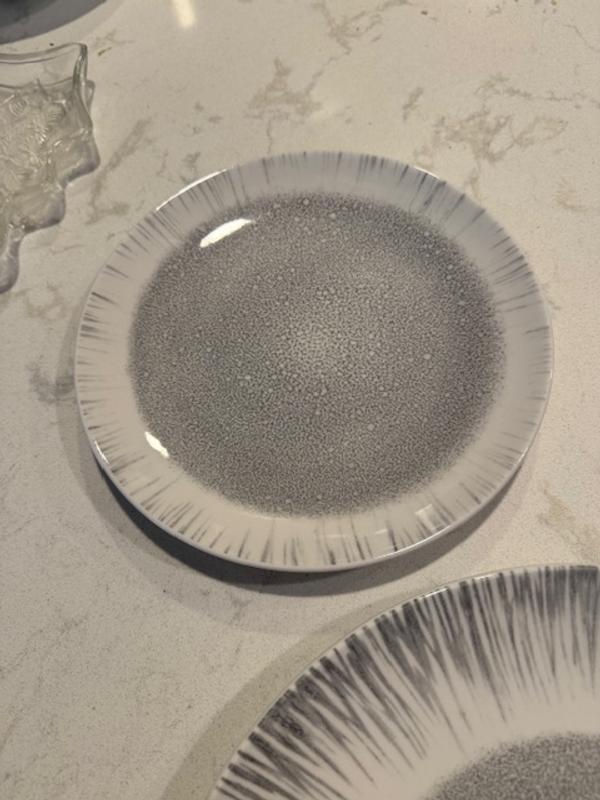 Nice design to the plates and bowl.  The sheen gives it a more elegant feel.  It is a nice everyday to party set that can be washed in the dishwasher.