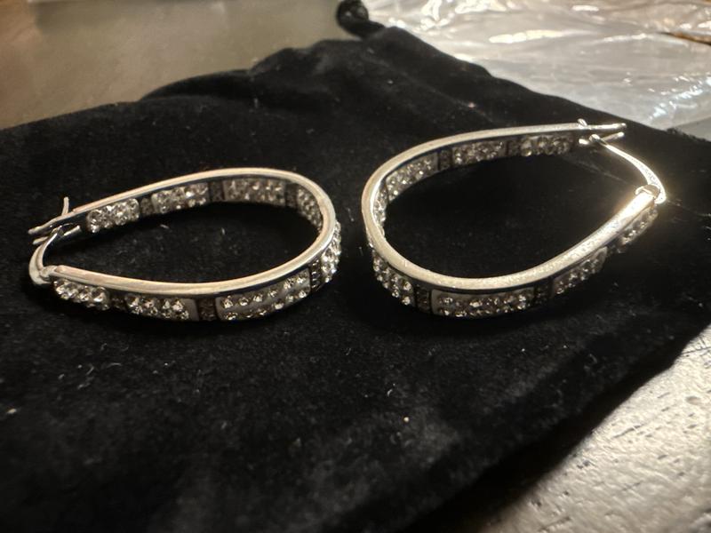 1st photo shows resin on earring.  2pic shows stones laid in white resin