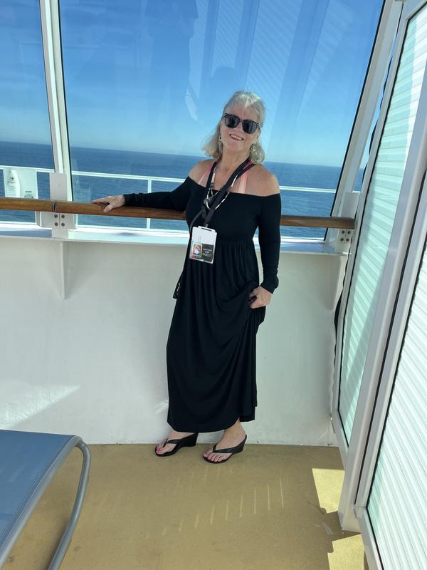 My bathing suit long coverup dress and the sandals on our balcony on board the Royal Caribbean Navigator of the Seas cruise ship.