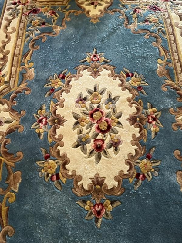 Examples of fibers coming out of rug.