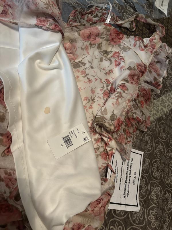 Received an obviously previously worn and returned dress as I think that is a blood stain on the under skirt.
