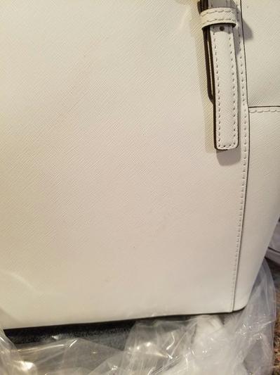 dirty/sticky discolored spots on back