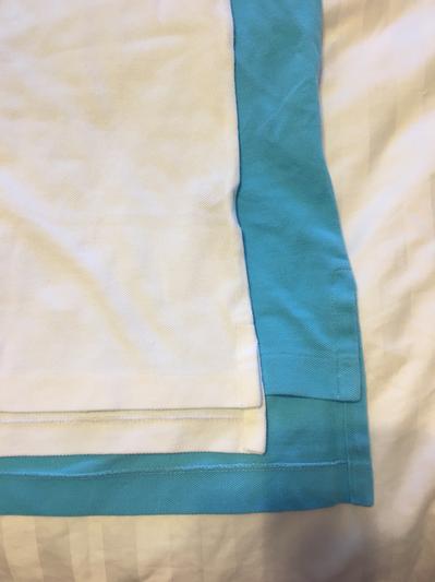 Custom Fit (white) laid on Classic Fit (blue) to illustrate difference in tail length