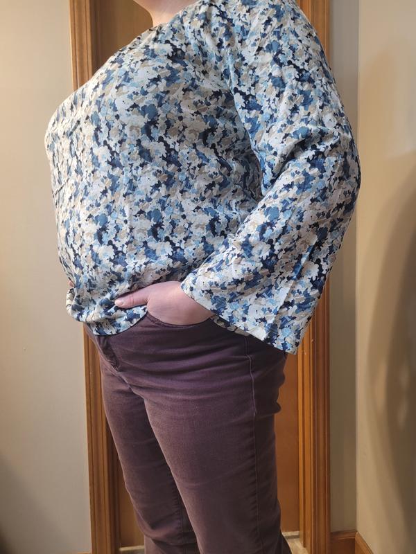 Sleeves have a small bell shape