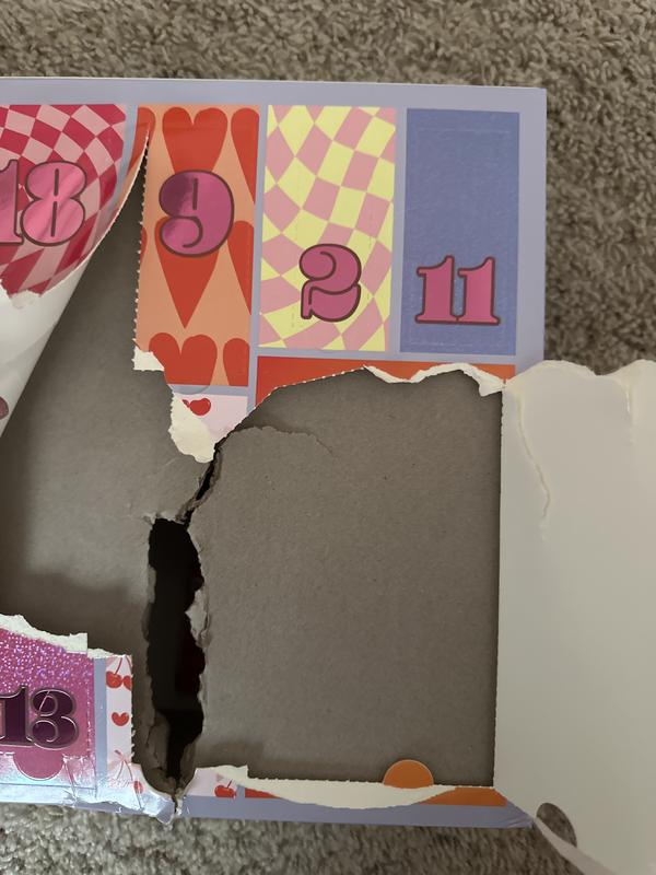 Here is the insanely thick piece of cardboard you can’t get to unless you use scissors just to have your item stuck to the very back of the box with plastic with no way to get that off either without opening the whole box and cutting it