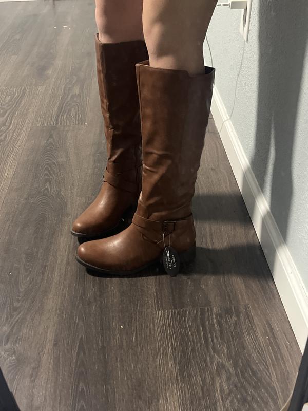 Pointing the the heel where the inside feels like it wasn’t placed correctly when manufacturing.