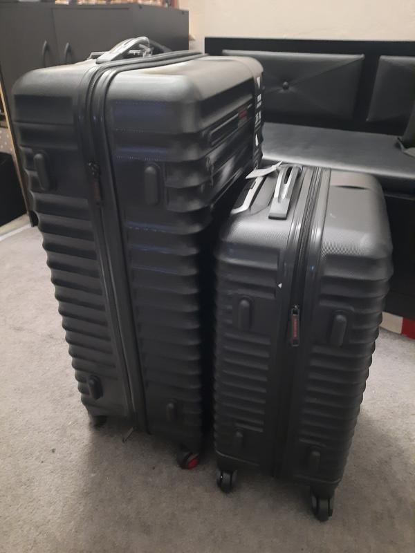 Carry on and checked bag side by side
