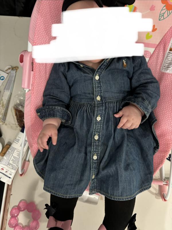 The baby is 5 months and that dress is 12 months, very long  with narrow torso