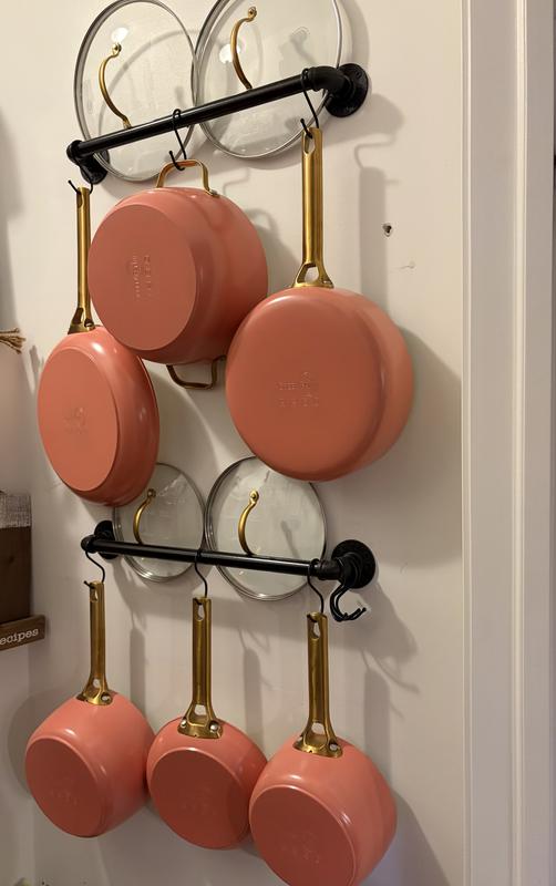 Hung in our pantry so they don’t scratch.