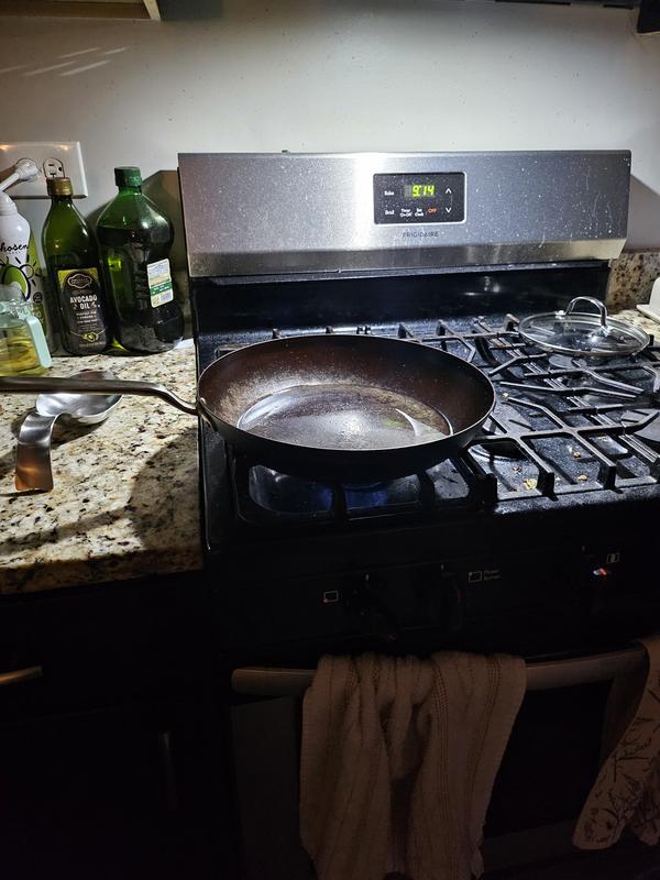 I found it a little difficult to document, perhaps my lighting, but here is the pan with about 3-4 tablespoons of oil poured into the center, but it runs off to the edges upon heating, and the center starts to smoke dry.