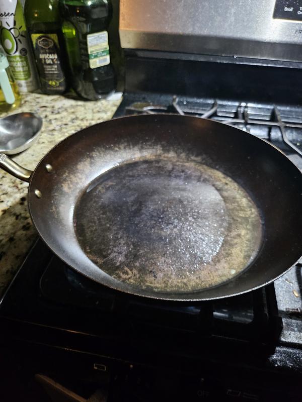 I found it a little difficult to document, perhaps my lighting, but here is the pan with about 3-4 tablespoons of oil poured into the center, but it runs off to the edges upon heating, and the center starts to smoke dry.