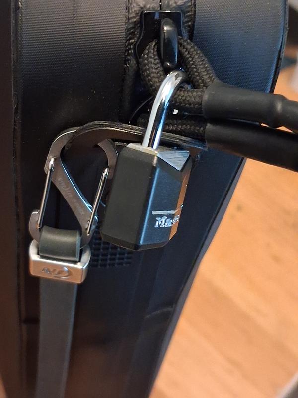 Carabiner loop used as secure lock spot using the zippers