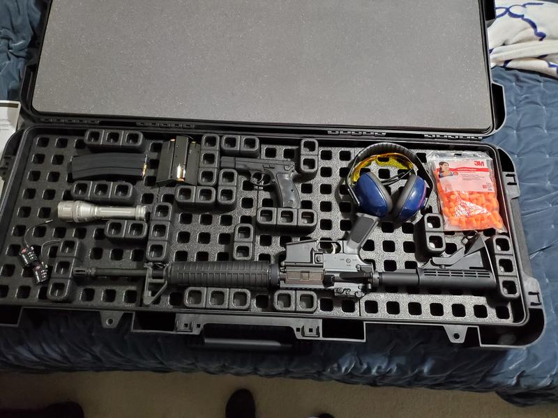 Stowed in my new R44 hard case with some PPE (eye and ear pro.)