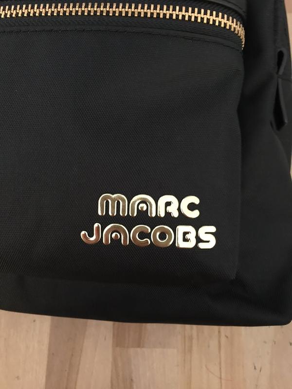 Love it! Hassle-free nylon backpack! Perfect size!