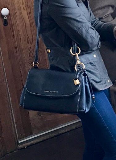 Worn on one shoulder with adjusted strap.