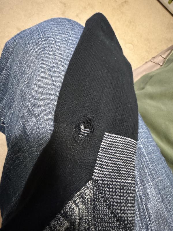 Hole torn while trying to work it over my heel for the first wear