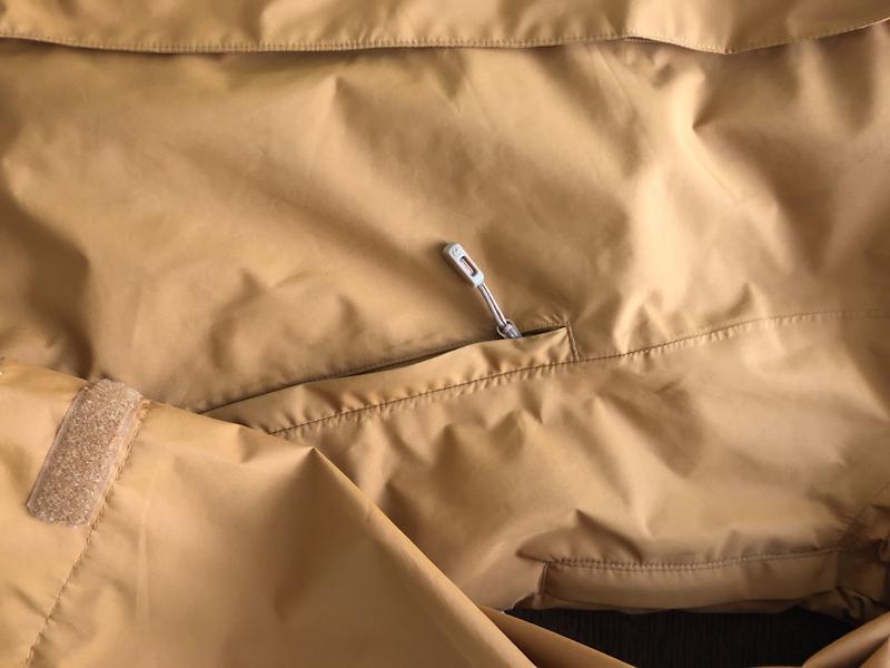 Generally a zipper flap is sewn on the other side of the zipper, so that it does not interfere with access to the pocket.