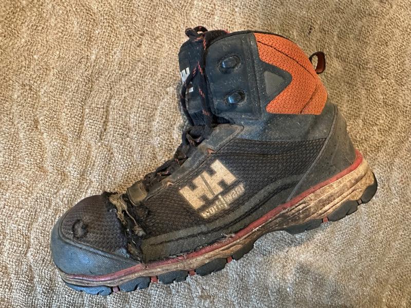 Fabric upper has ripped open and departed behind the aluminum toe cap.