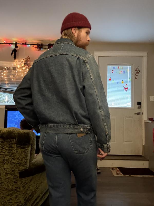 The jacket in these photos is a medium. The jacket in the video is a small. The photos above showed that it is is loose and it puffs from my stomach. Good for wearing a hoodie beneath or sweater in the video. It’s nice and tapered only a T-shirt beneath.