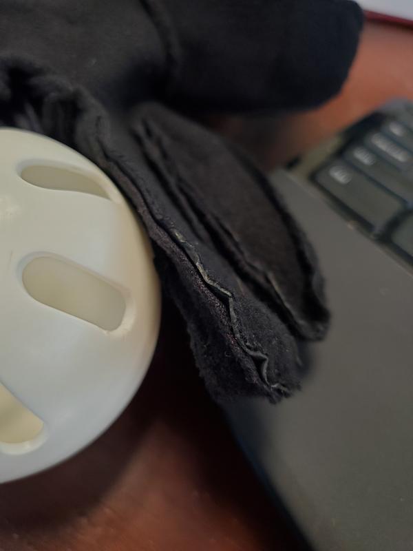 Ridge where finished fabric is bonded to base layer in fingertip in-seam