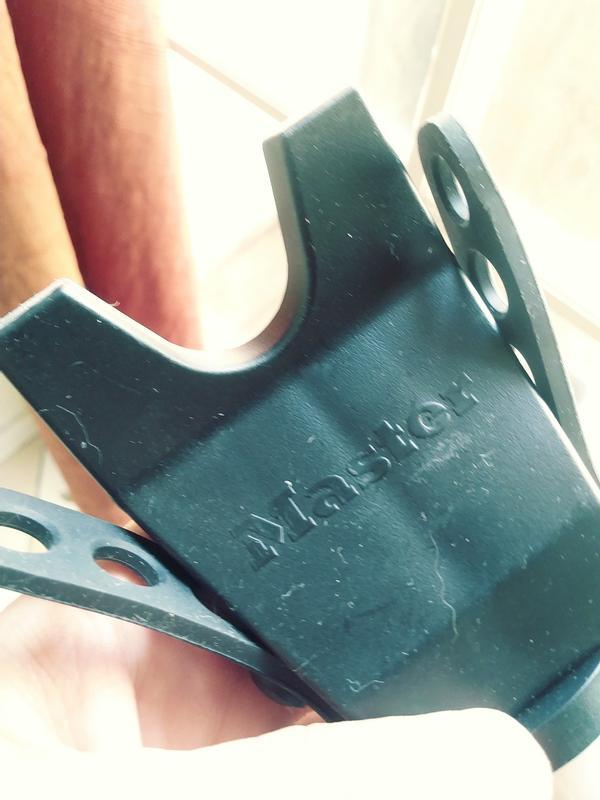 This side has a scoop for a door handle and a strap to go over the top to keep it secure