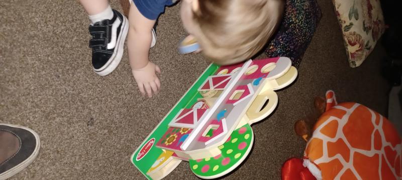 Son playing with the toy