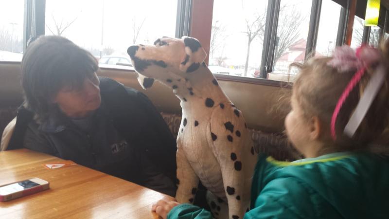 Sitting at dining table at local Restaurant.