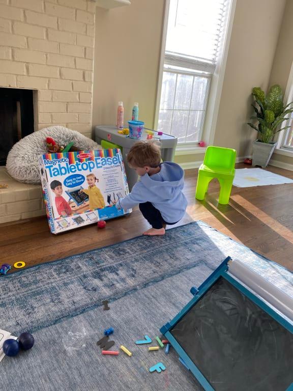 Maddox loved looking at the box then going to the easel and drawing