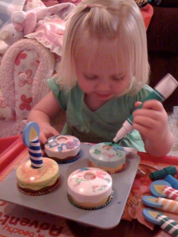Decorating her cupcakes!!!