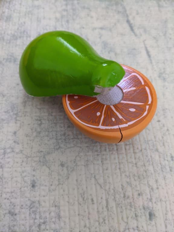 Paint peeling off pear, crack in orange